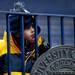 Traverse City resident Ryder Campbell, five, licks a cold metal bar during the alumni spring flag football game on Saturday, April 13. AnnArbor.com I Daniel Brenner